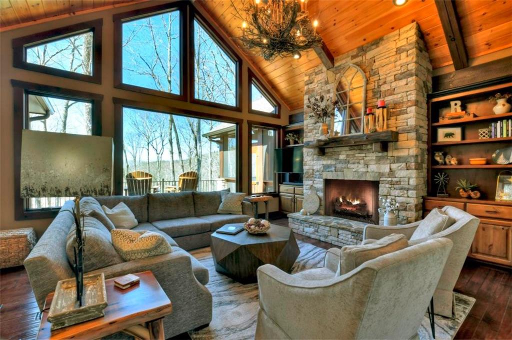 244 Wilderness Way Ellijay, GA 30536 - Photo 5 of 78 a living room with furniture fireplace and a large window