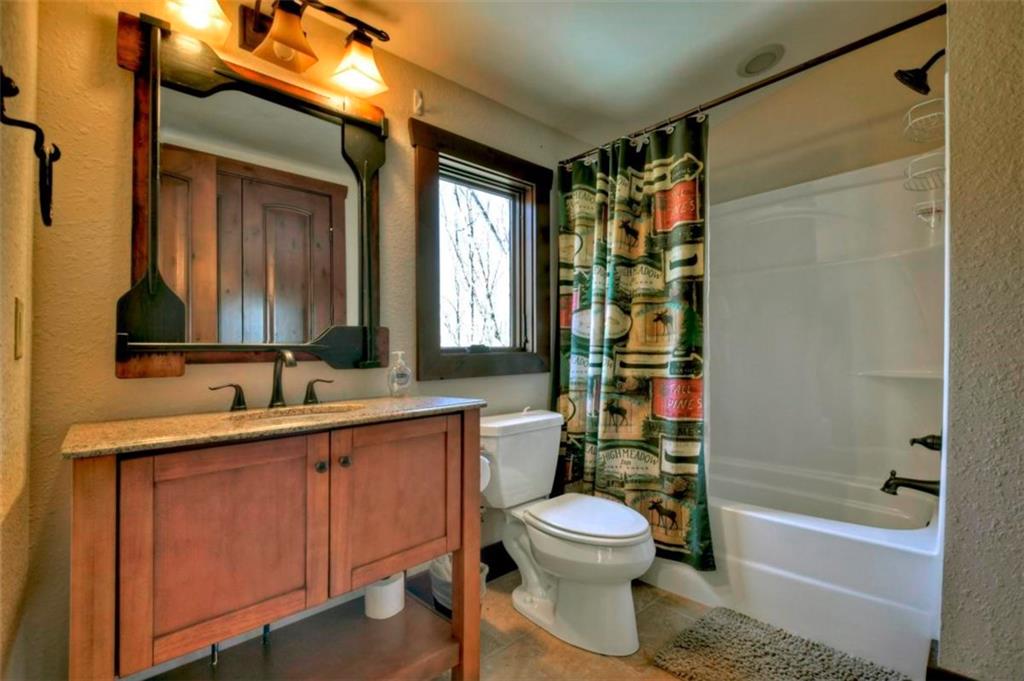 244 Wilderness Way Ellijay, GA 30536 - Photo 51 of 78 a bathroom with a toilet sink and shower