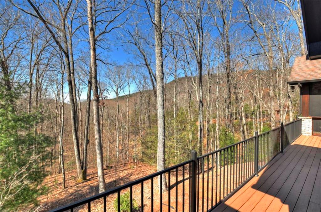 244 Wilderness Way Ellijay, GA 30536 - Photo 53 of 78 a view of a balcony with wooden floor and fence
