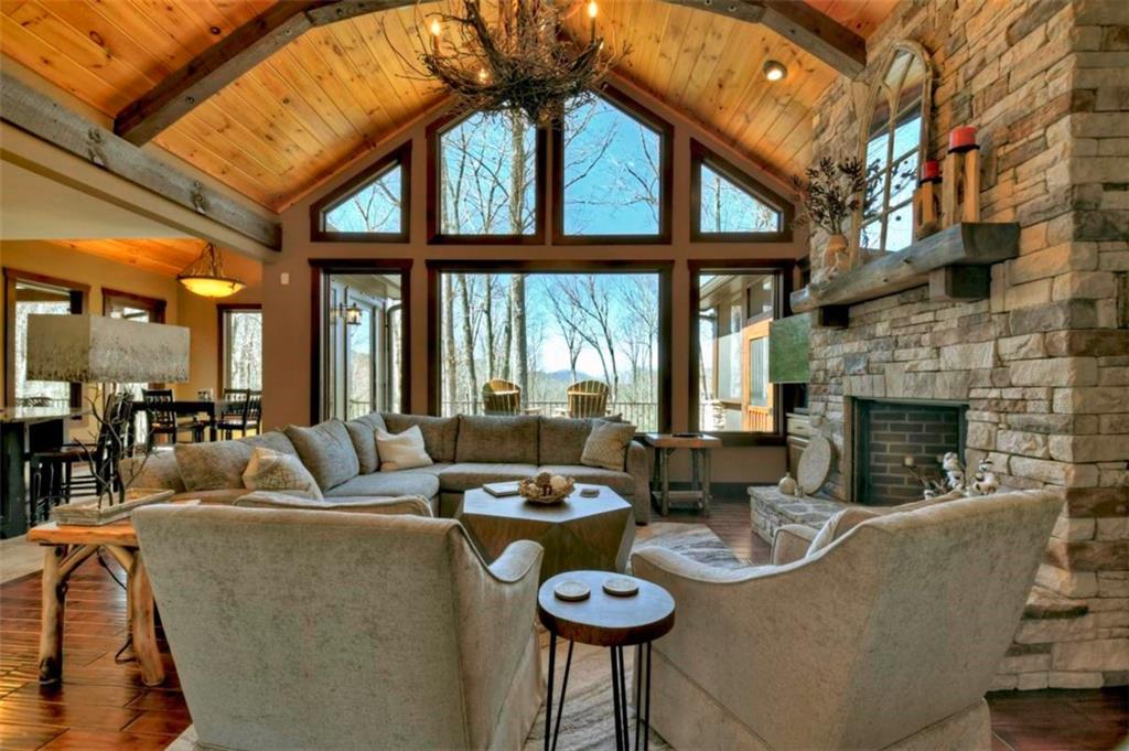 244 Wilderness Way Ellijay, GA 30536 - Photo 6 of 78 a living room with furniture and a fireplace