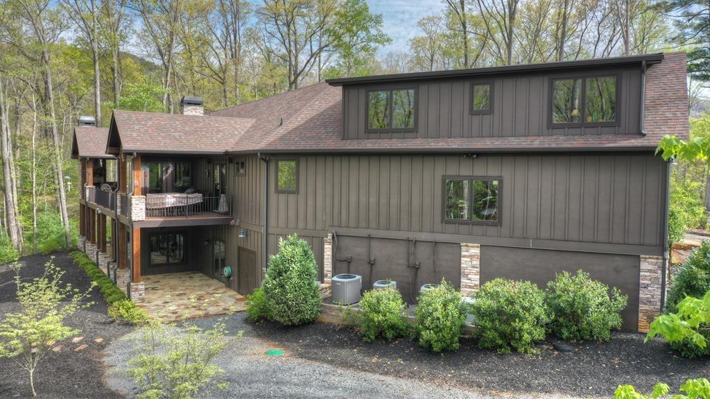 244 Wilderness Way Ellijay, GA 30536 - Photo 68 of 78 a front view of a house with a garden
