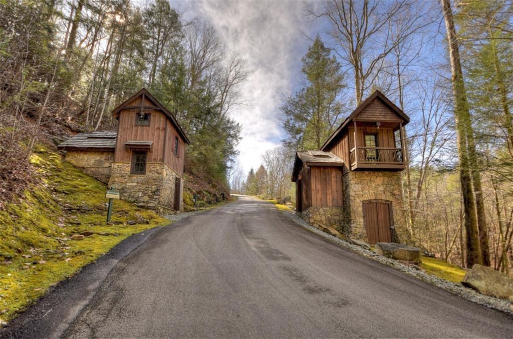 244 Wilderness Way Ellijay, GA 30536 - Photo 76 of 78 a front view of a house with a yard
