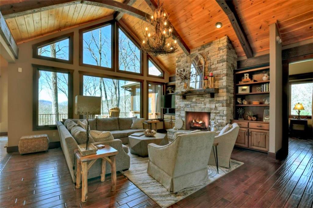 244 Wilderness Way Ellijay, GA 30536 - Photo 8 of 78 a living room with fireplace furniture and a large window