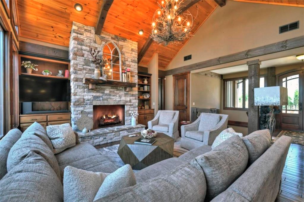 244 Wilderness Way Ellijay, GA 30536 - Photo 9 of 78 a living room with furniture and a fireplace