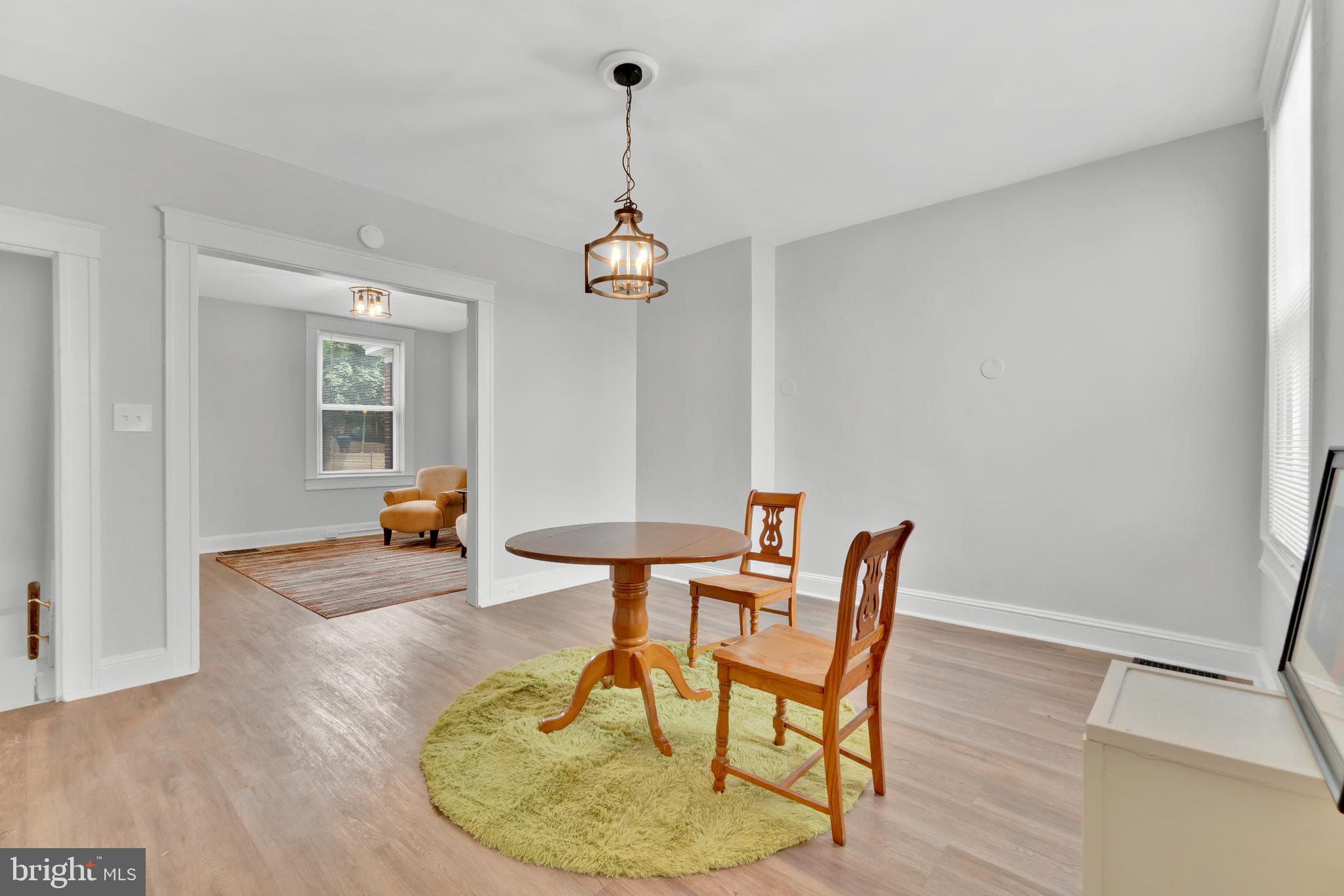 747 East 37th Street Baltimore, MD 21218 - Photo 13 of 53 a dining room with a table and chairs