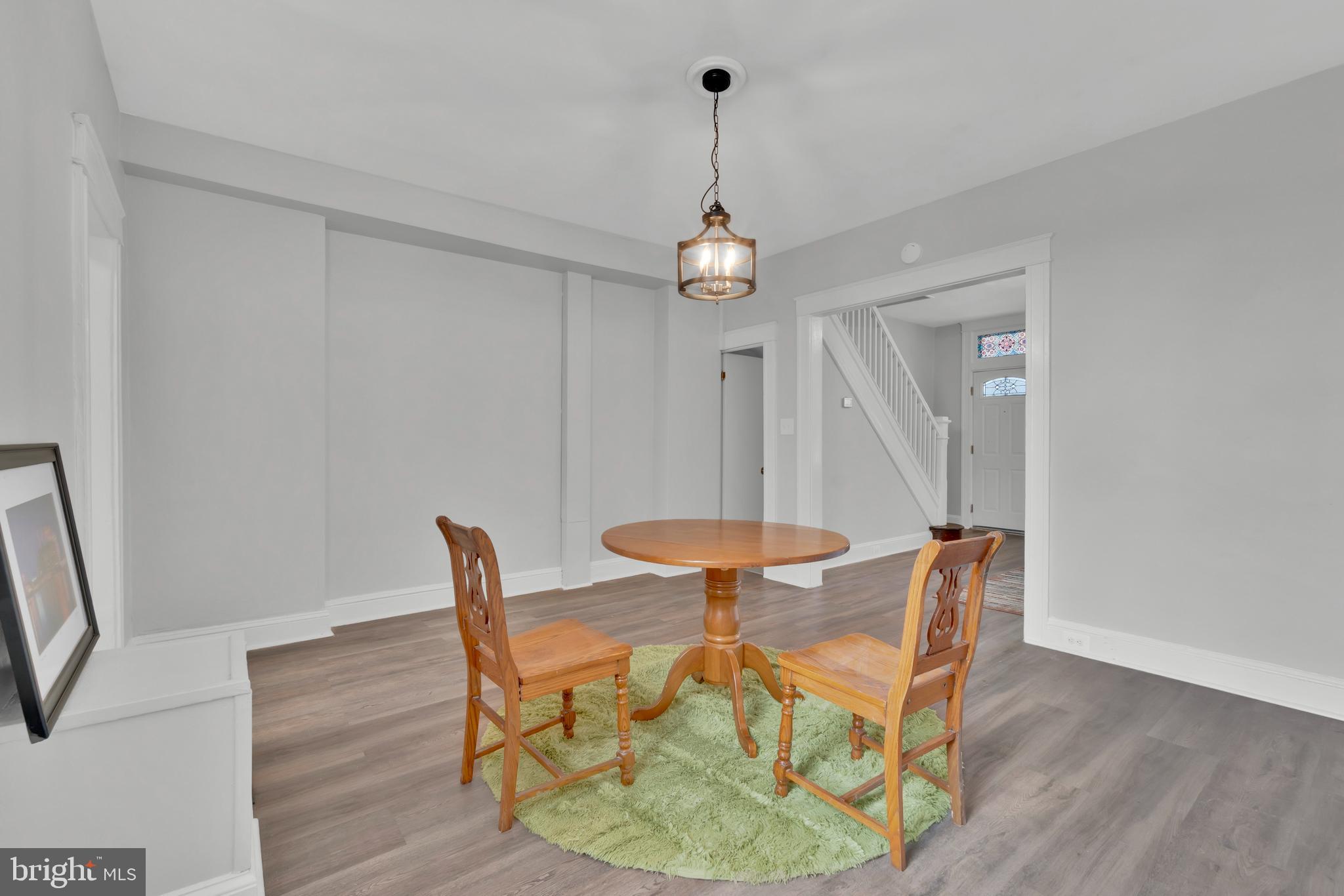 747 East 37th Street Baltimore, MD 21218 - Photo 15 of 53 a dining room with furniture and wooden floor