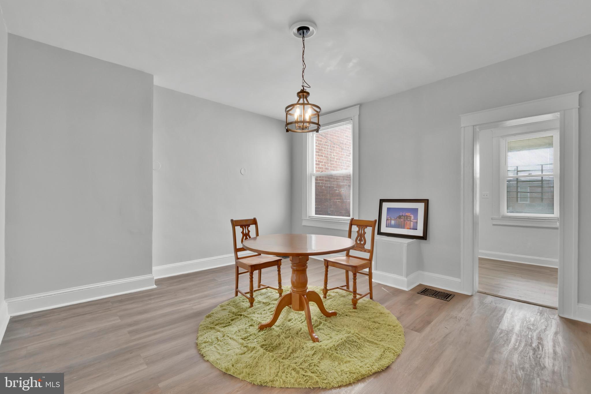 747 East 37th Street Baltimore, MD 21218 - Photo 16 of 53 a dining room with a table and chairs