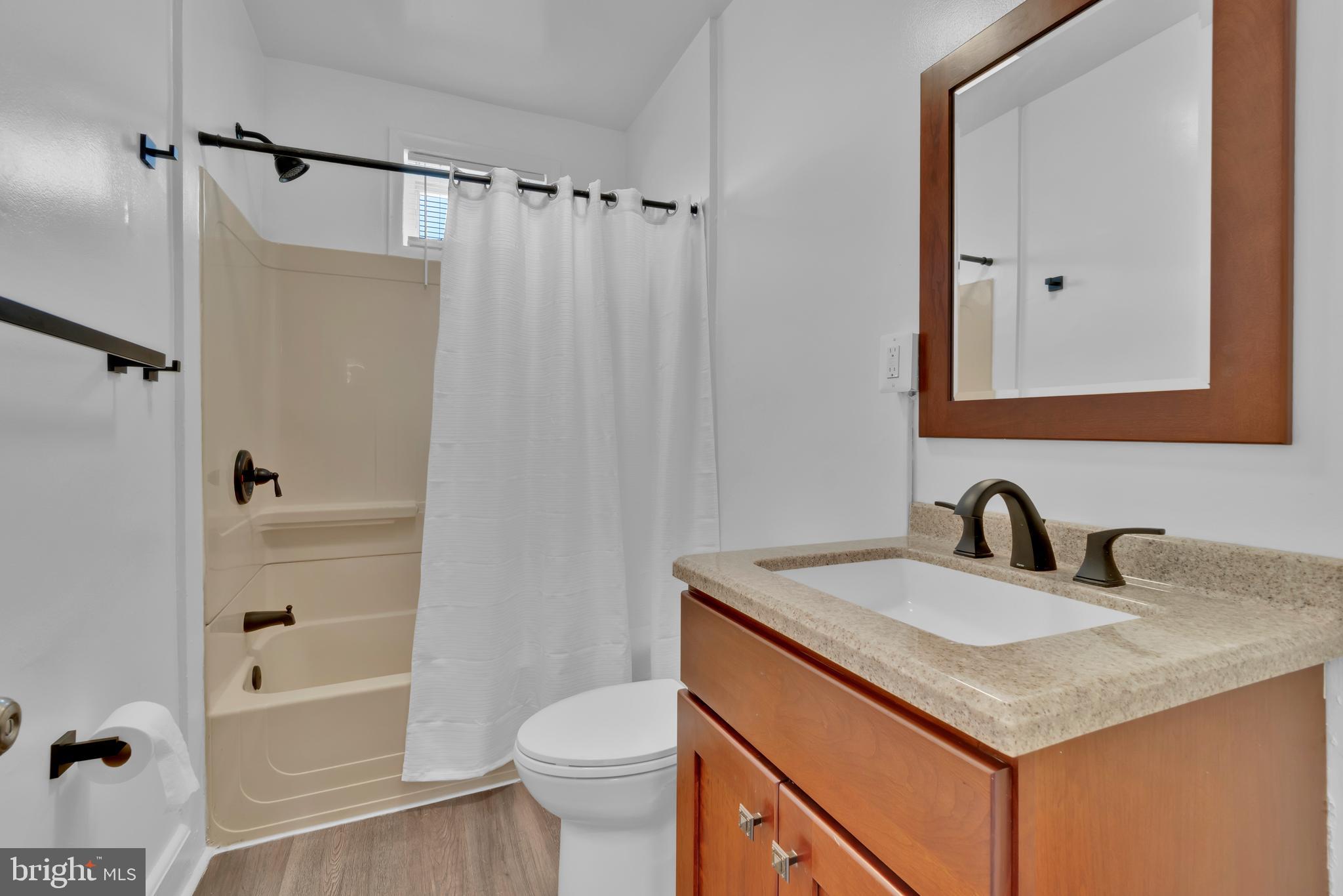 747 East 37th Street Baltimore, MD 21218 - Photo 30 of 53 a bathroom with a sink toilet and shower