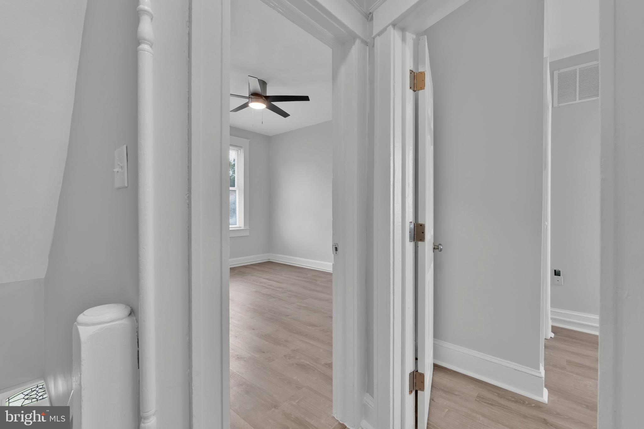 747 East 37th Street Baltimore, MD 21218 - Photo 32 of 53 a view of a hallway with wooden floor