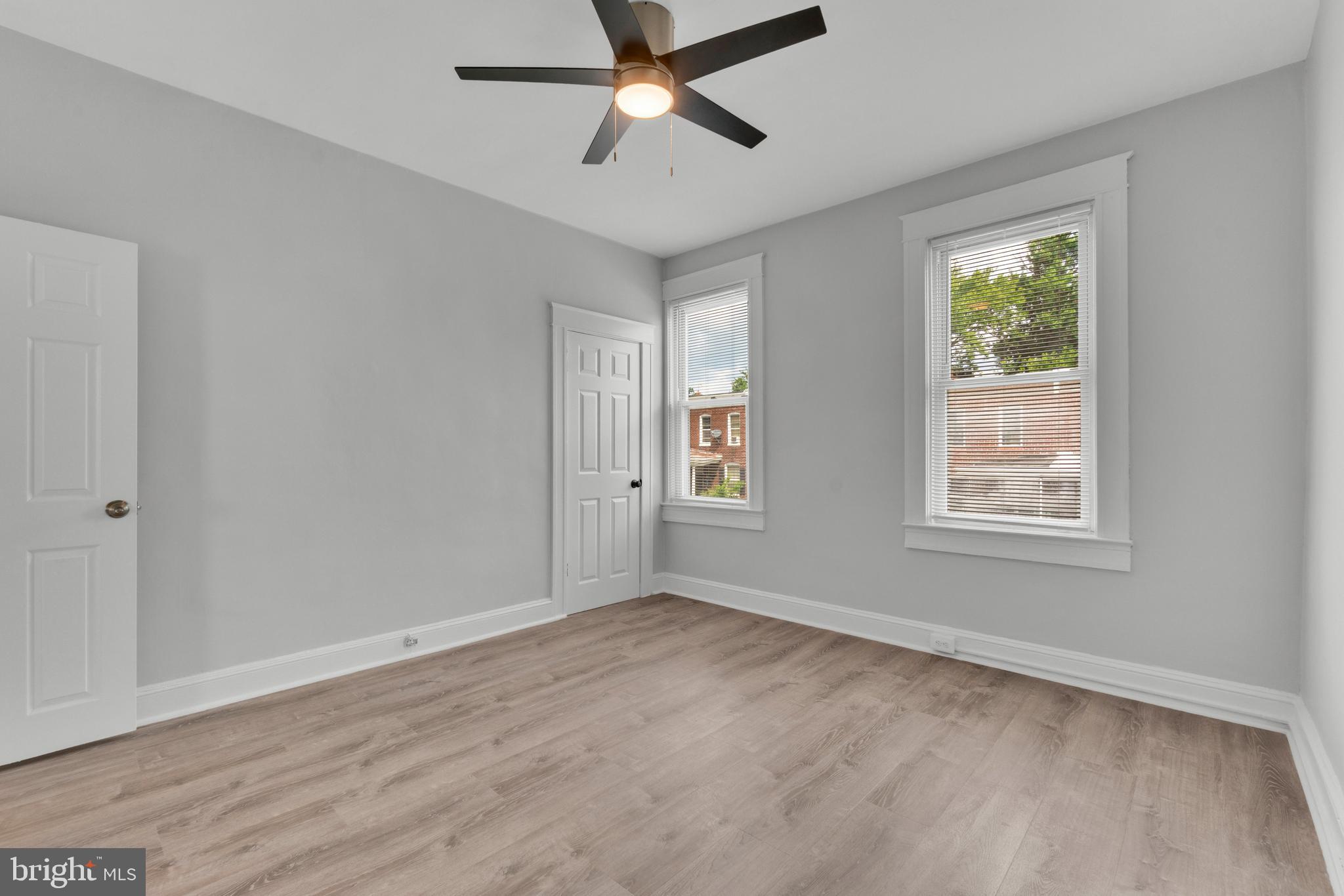 747 East 37th Street Baltimore, MD 21218 - Photo 36 of 53 a view of an empty room with a window and wooden floor