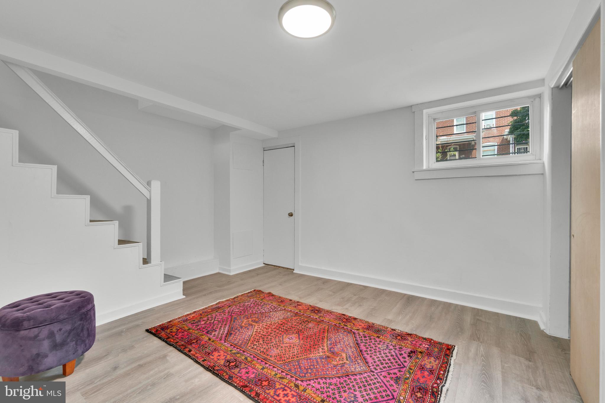 747 East 37th Street Baltimore, MD 21218 - Photo 41 of 53 a view of a livingroom with wooden floor and a cabinet