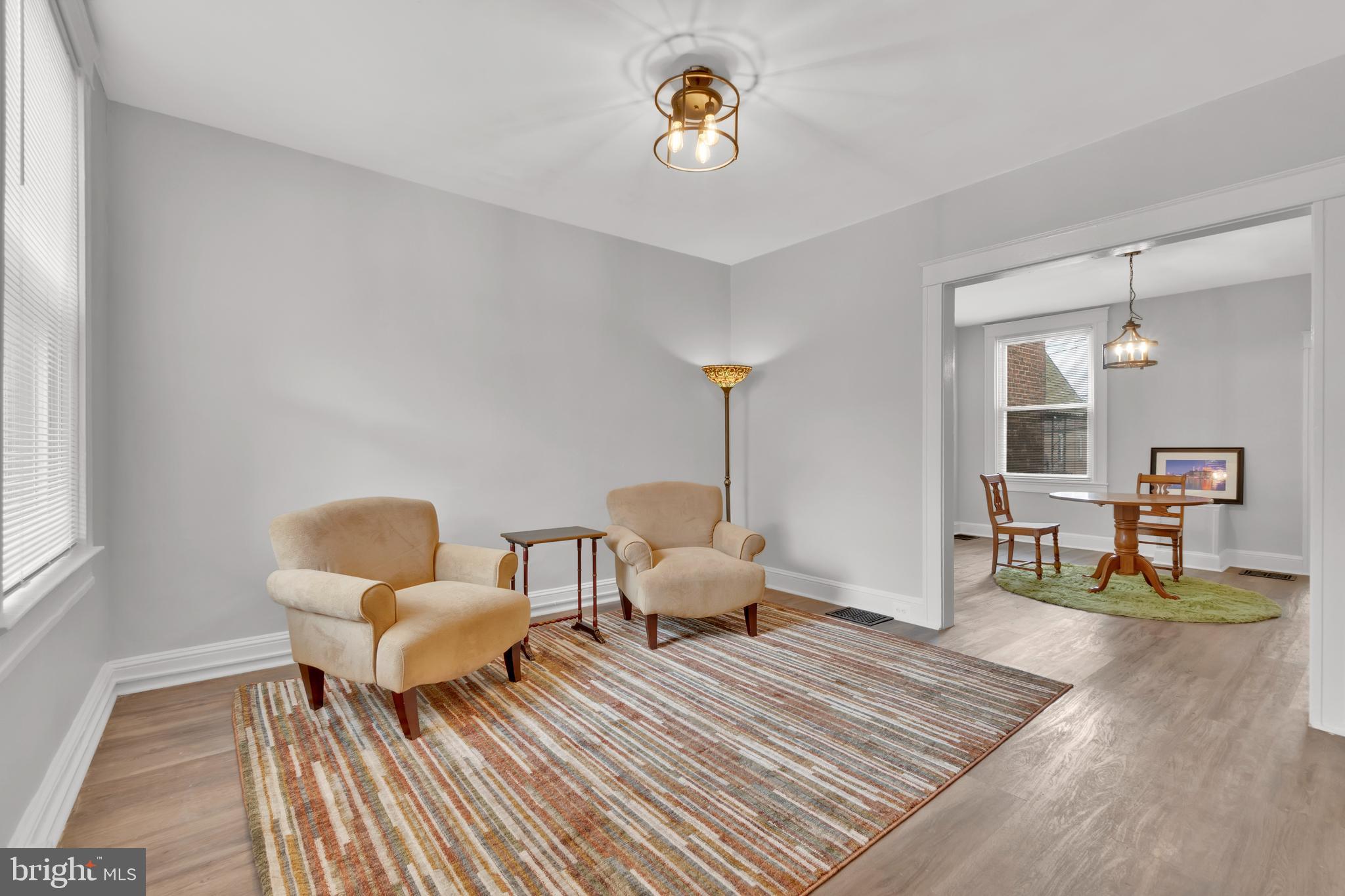 747 East 37th Street Baltimore, MD 21218 - Photo 7 of 53 a living room with furniture and a wooden floor