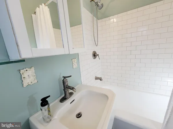 a bathroom with a sink and a tub