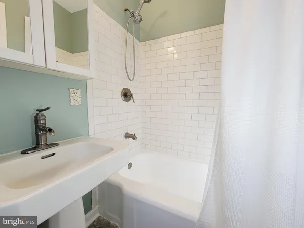 a bathroom with a sink and a bathtub