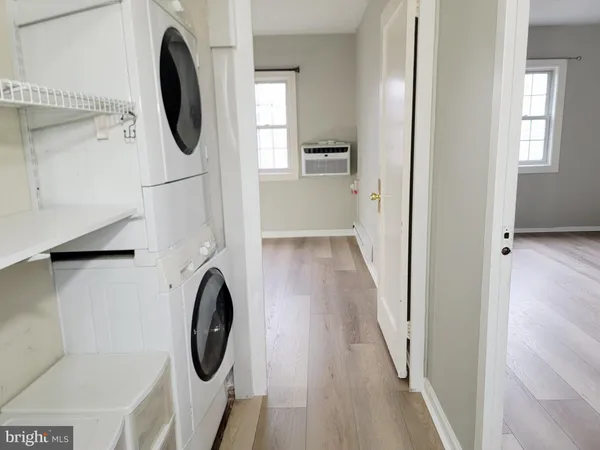 a view of a hallway with washer and dryer
