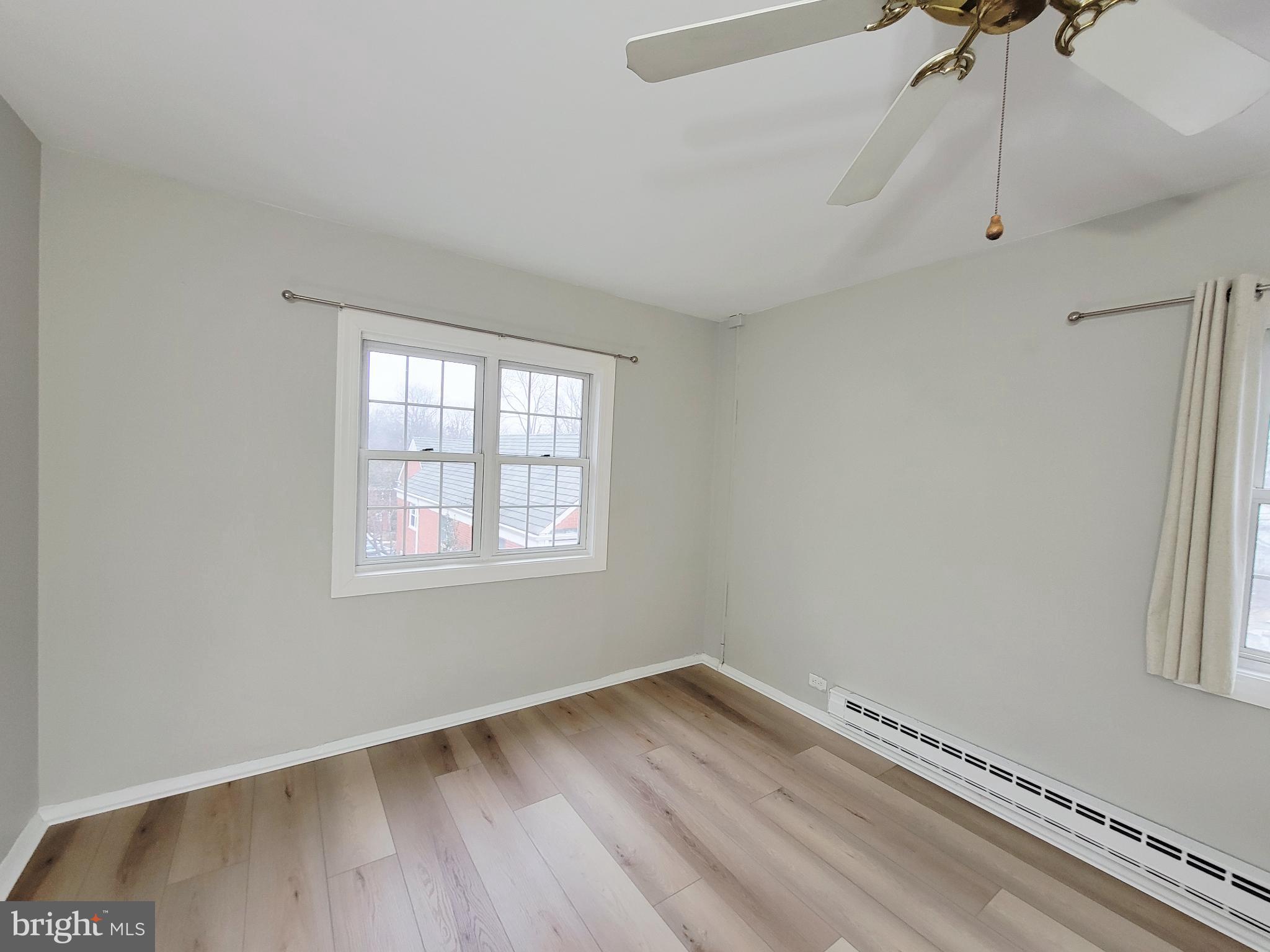 3408 Gunston Road Alexandria, VA 22302 - Photo 27 of 27 a view of an empty room with wooden floor and a window