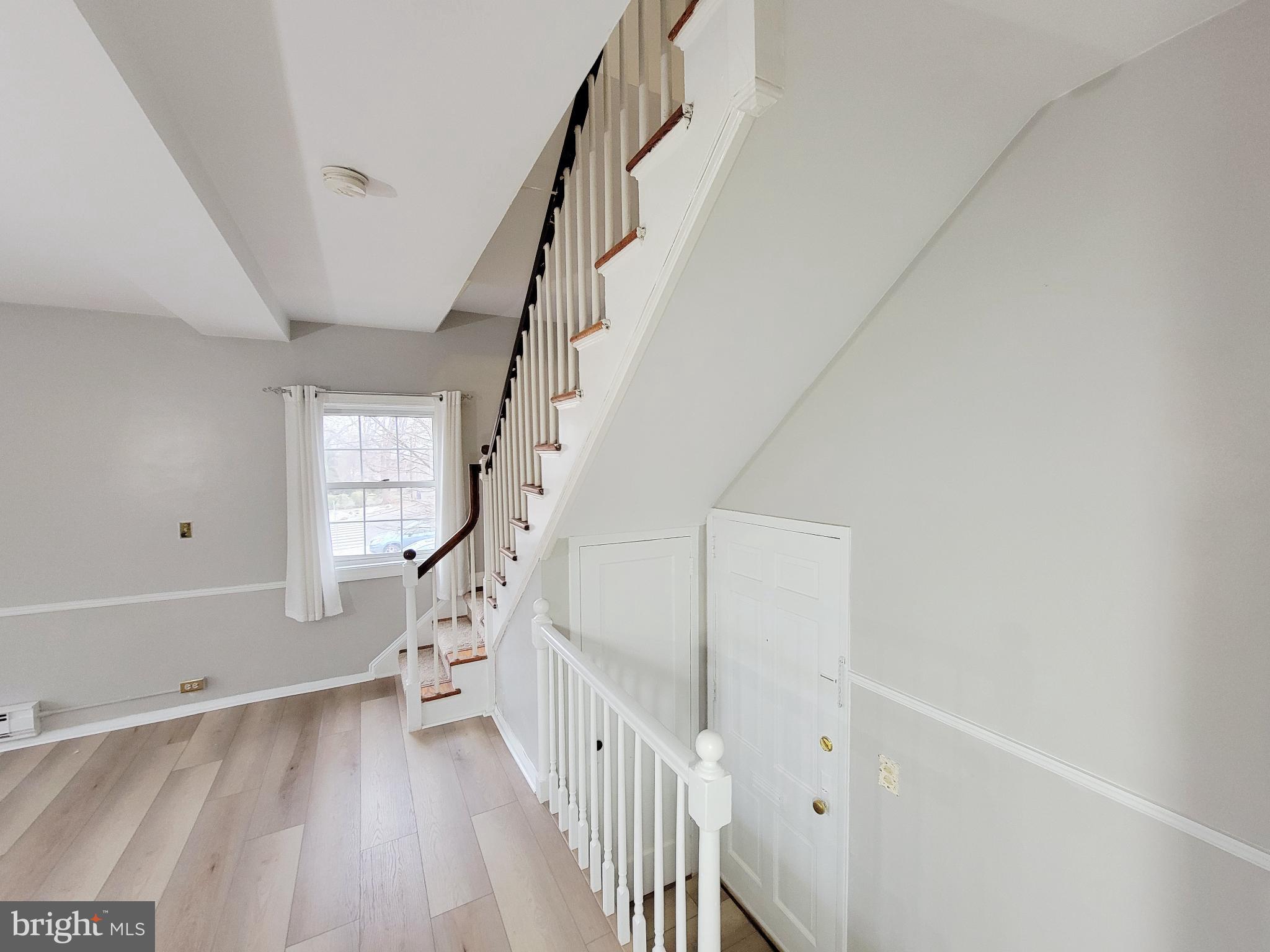 3408 Gunston Road Alexandria, VA 22302 - Photo 3 of 27 a view of entryway with stairs and wooden floor