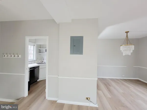 a view of a kitchen with a sink dishwasher and a refrigerator