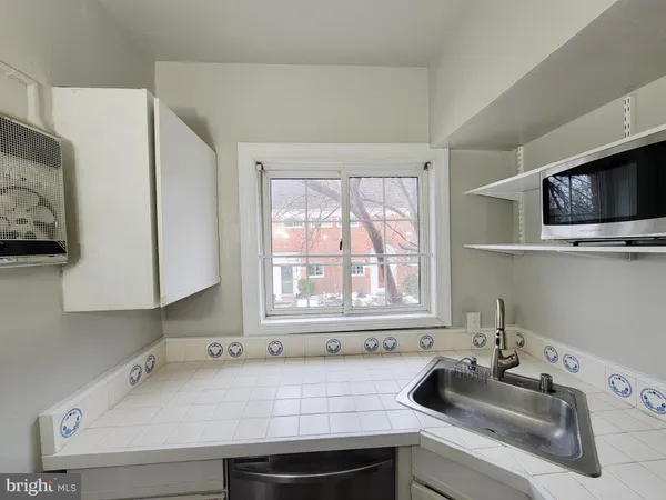a bathroom with a sink and a window