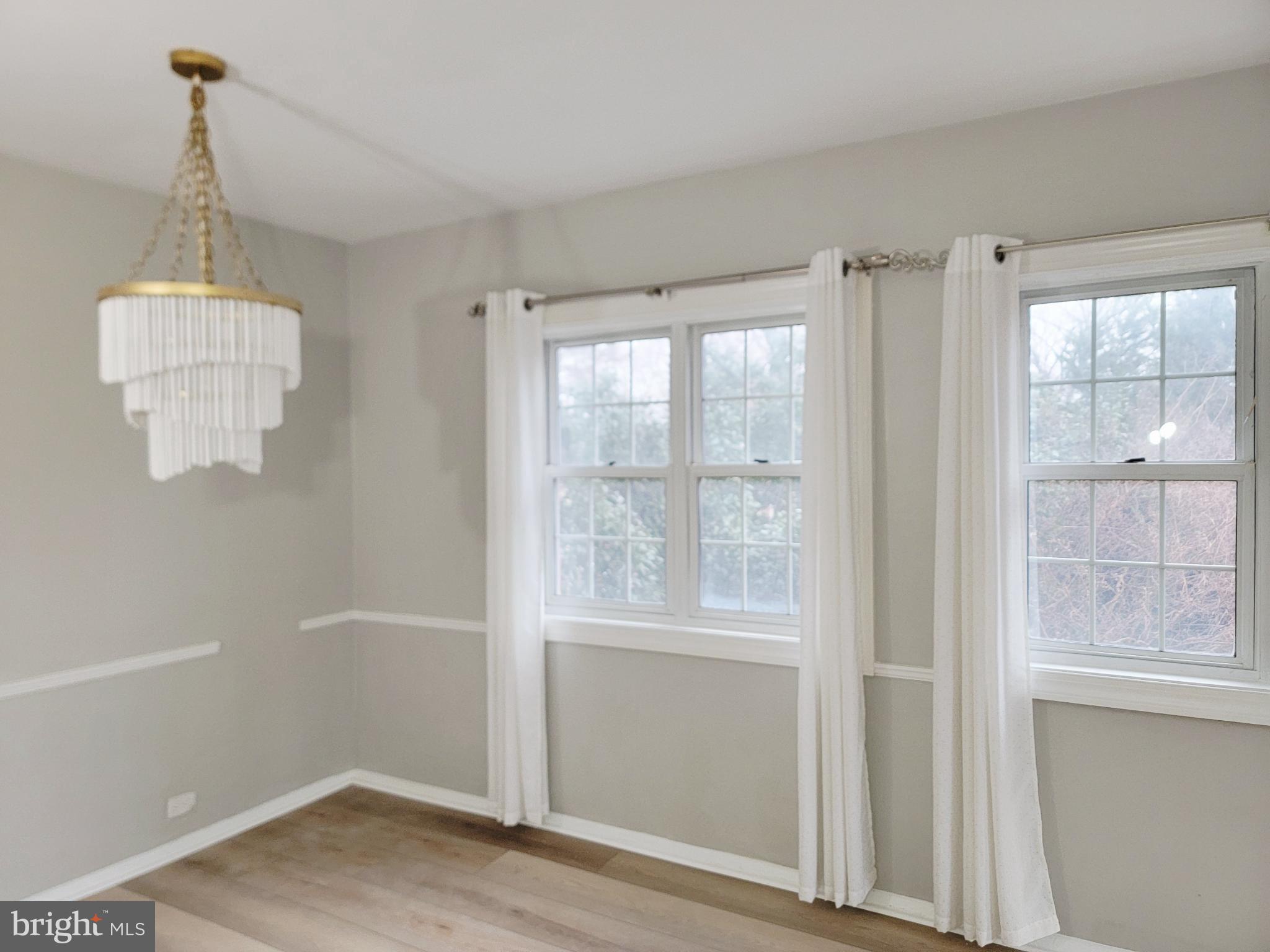 3408 Gunston Road Alexandria, VA 22302 - Photo 8 of 27 a view of empty room with wooden floor and fan