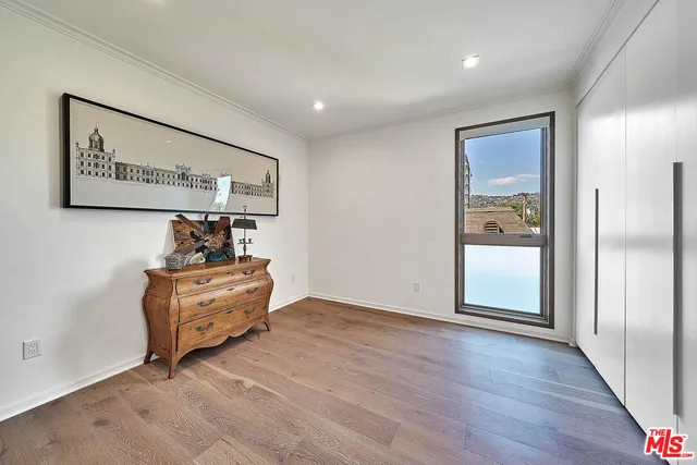 a room with furniture and wooden floor