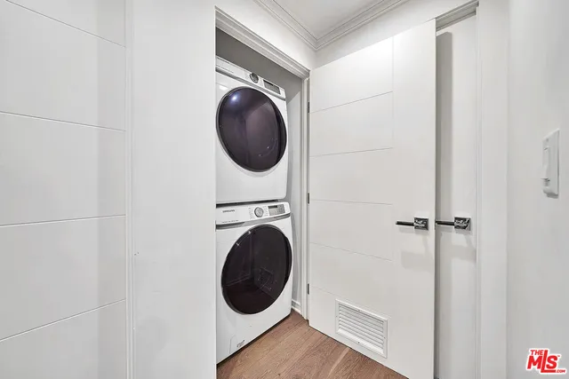 a view of a hallway with washer and dryer