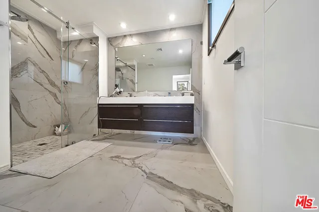 a bathroom with a sink and mirror