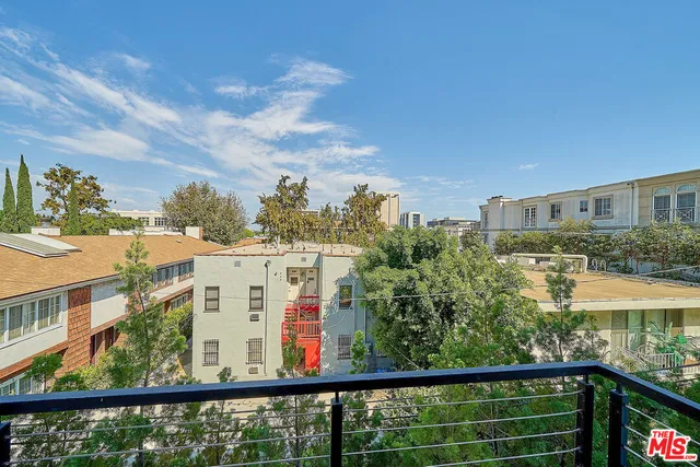 a view of a building from a balcony