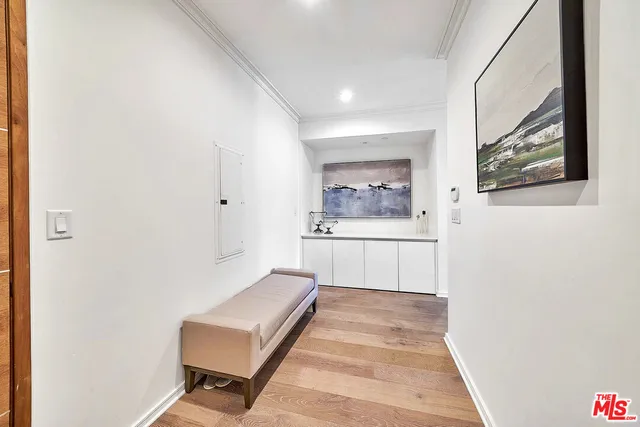a view of a hallway with paintings on the wall
