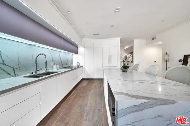a view of a living room with wooden floor