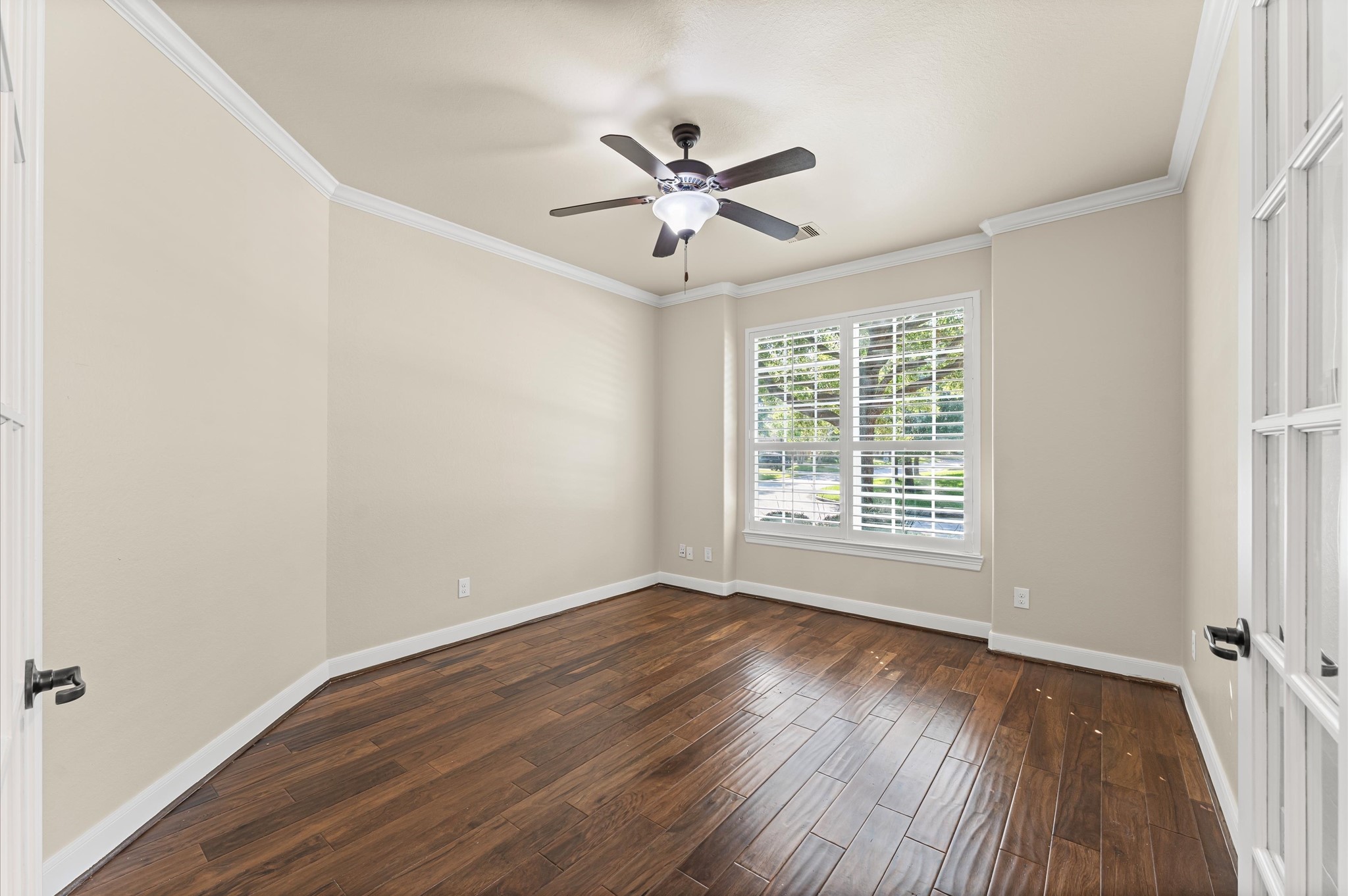 7 North Beech Springs Circle Spring, TX 77389 - Photo 14 of 50 a view of a room with wooden floor fan and windows