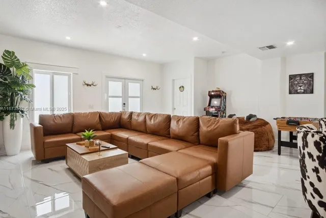 a bathroom with a bathtub sink mirror and toilet