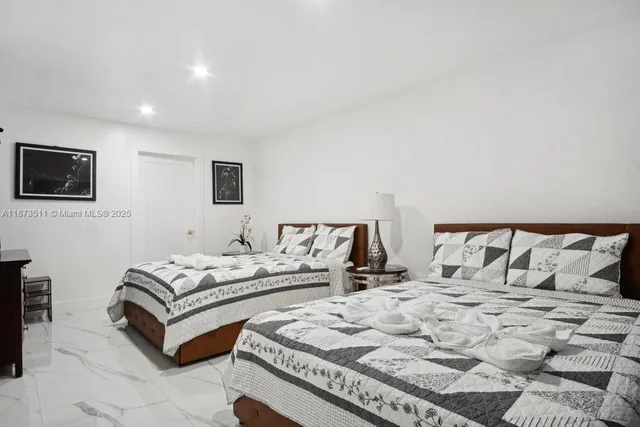 a bathroom with a sink toilet vanity and shower