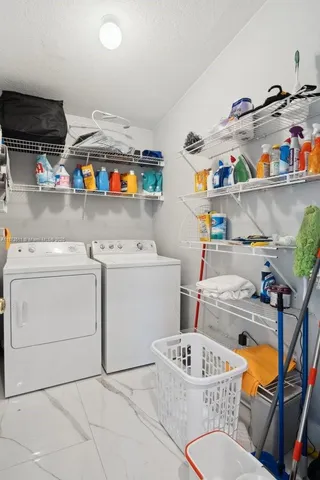 a kitchen with stainless steel appliances granite countertop a refrigerator stove top oven and sink