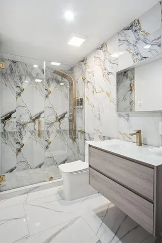 a kitchen with sink cabinets and stainless steel appliances
