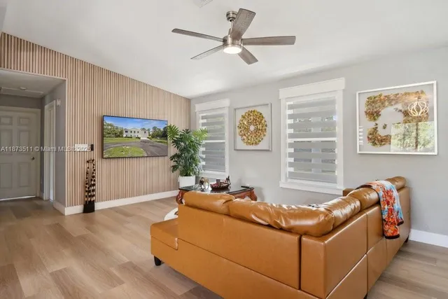 a bedroom with a bed and a tv