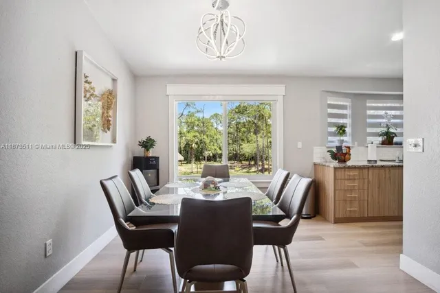 a bathroom with a granite countertop sink and a shower