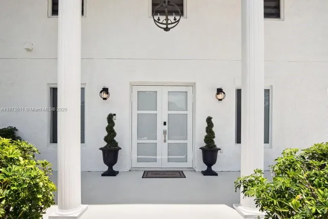 a aerial view of a house with table and chairs