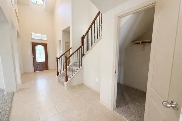 a view of a hallway with staircase