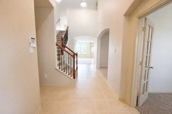 a view of a hallway with staircase