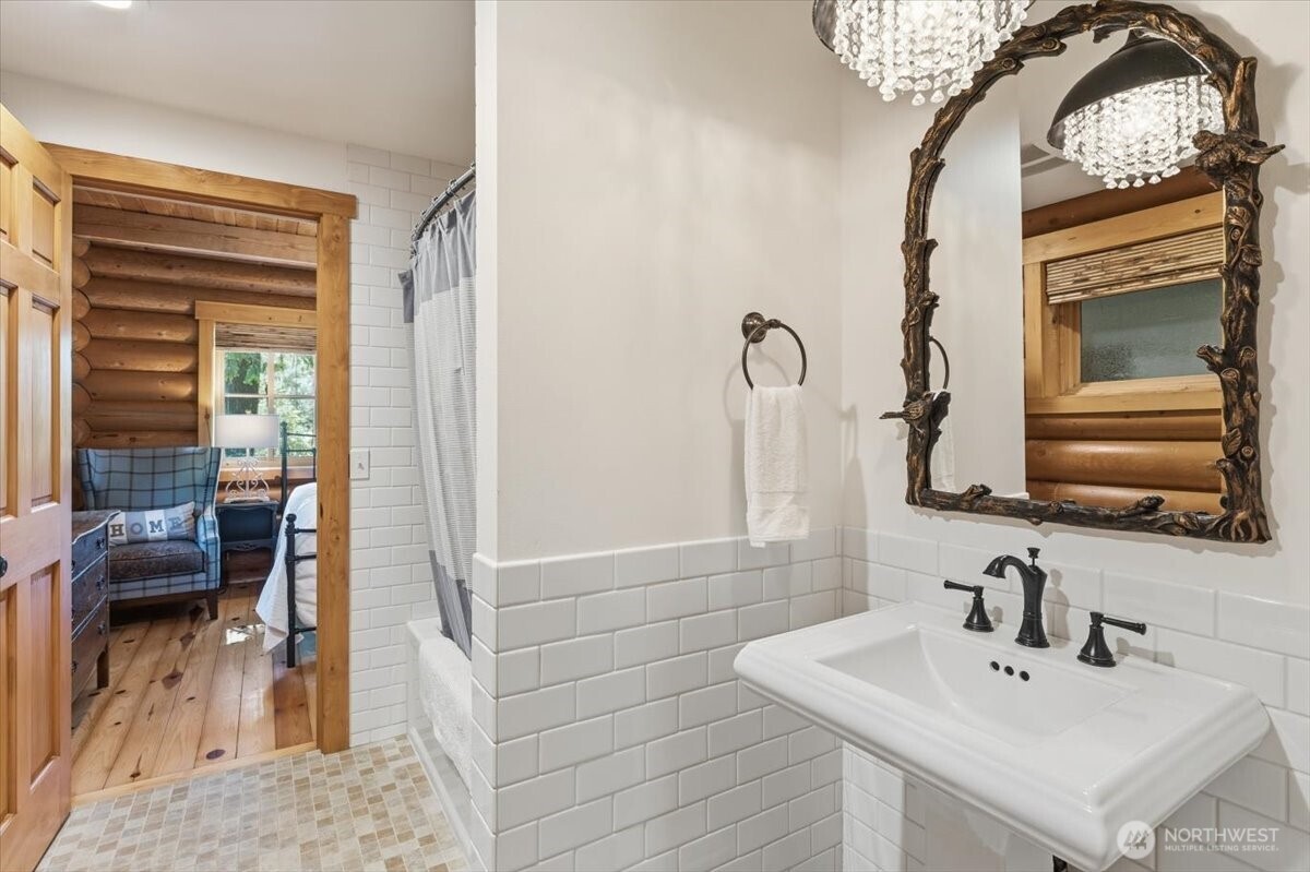 2250 First Crk Road Chelan, WA 98816 - Photo 20 of 39 a bathroom with a sink a toilet and a mirror