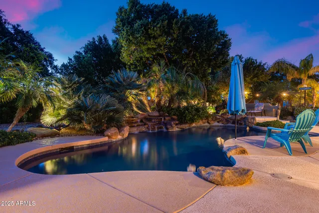 a view of a swimming pool with an outdoor space and seating area