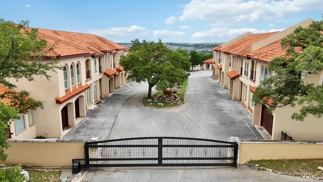 a view of a couches with wooden fence