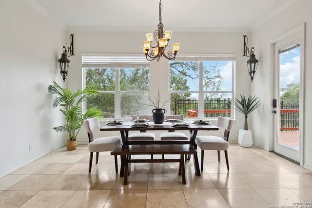 a view of a dining room with furniture window and outside view