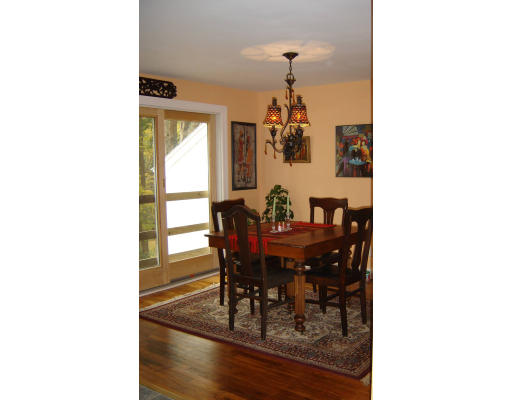 40 Maple Street Sturbridge, MA 01566 - Photo 3 of 5 a view of a dining room with furniture and chandelier