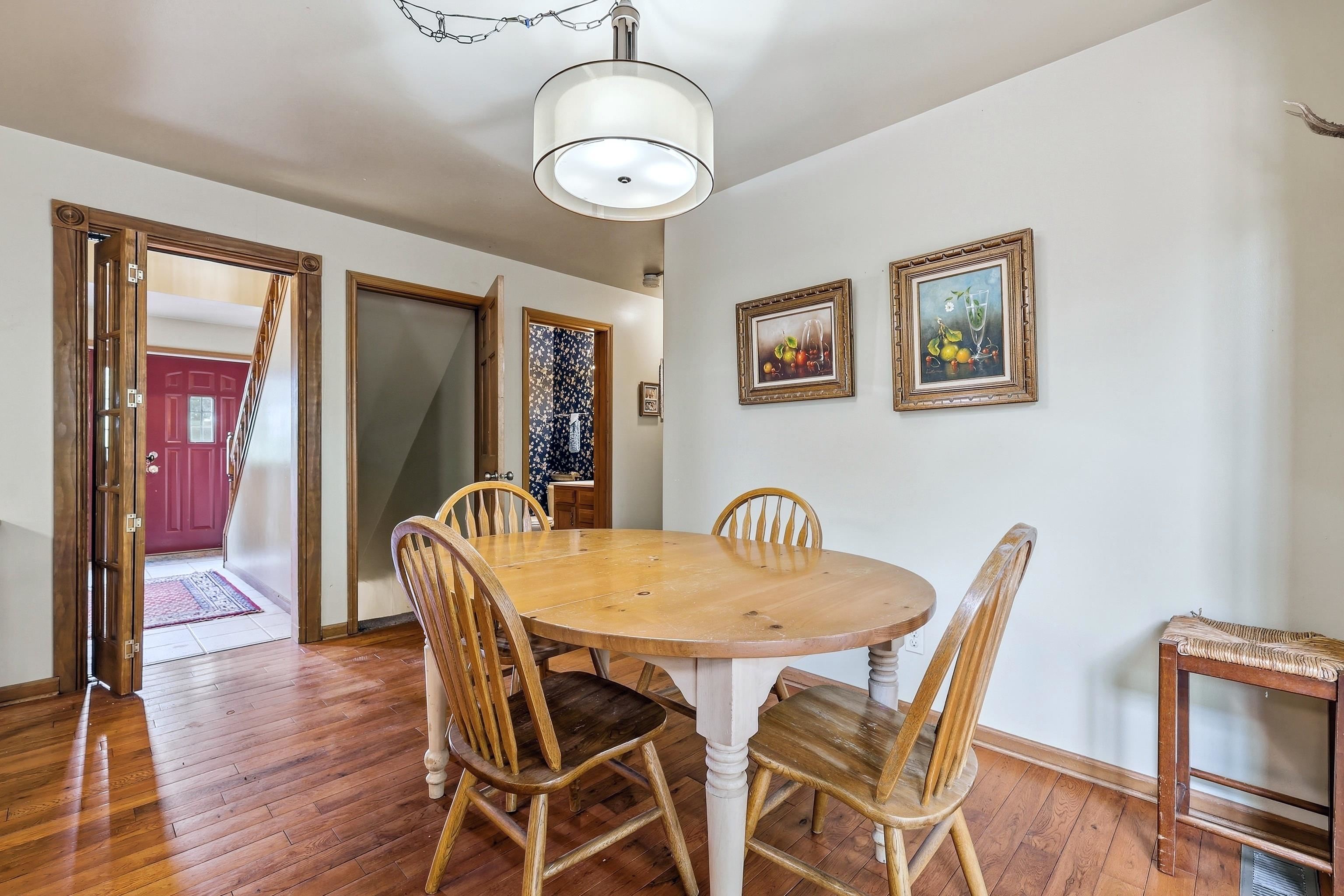 13 Signal Point Lane Galena, IL 61036 - Photo 13 of 47 a view of a dining room with furniture wooden floor and chandelier