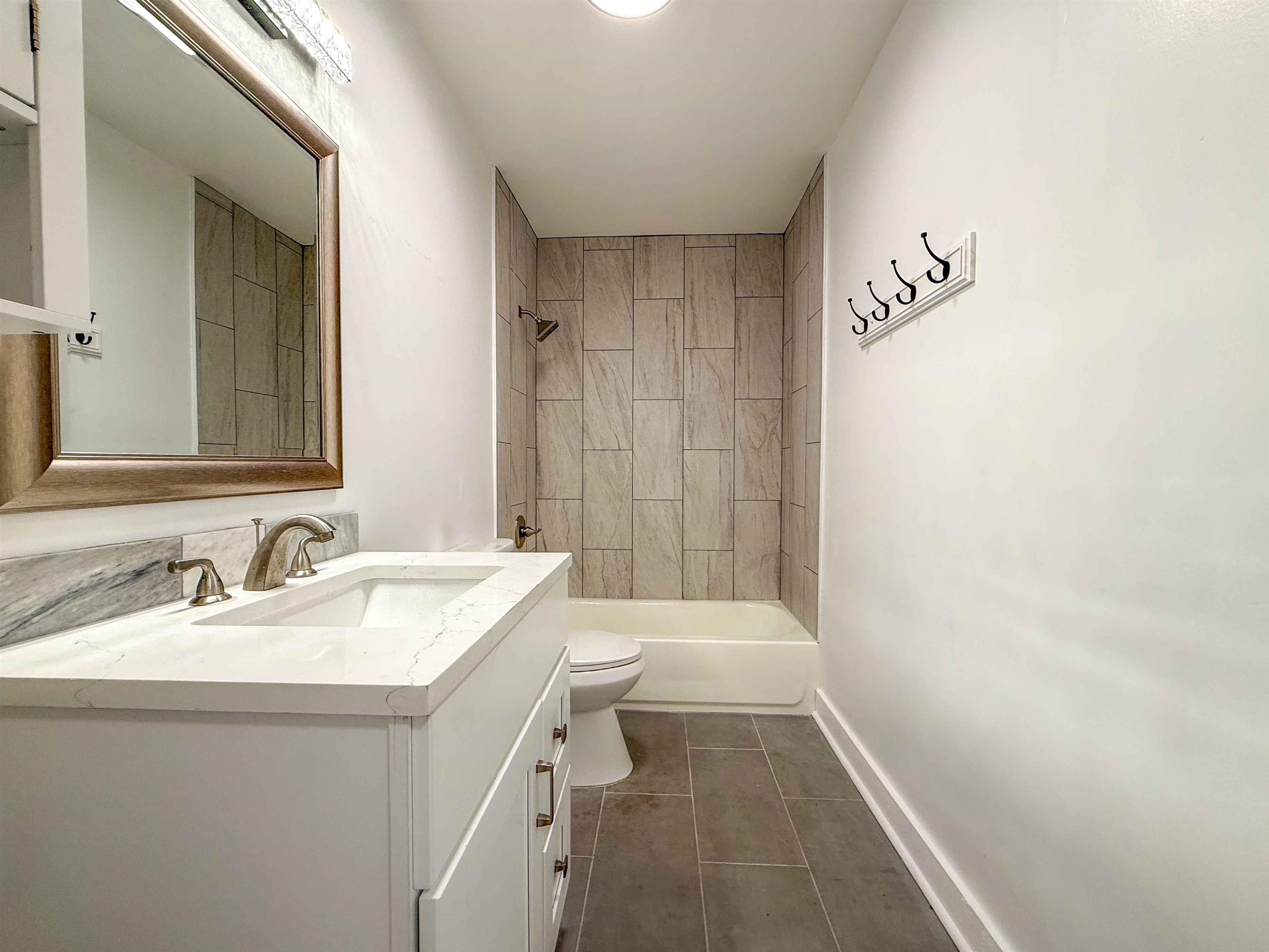 2582 James Road Memphis, TN 38127 - Photo 11 of 36 a bathroom with a sink a toilet and shower