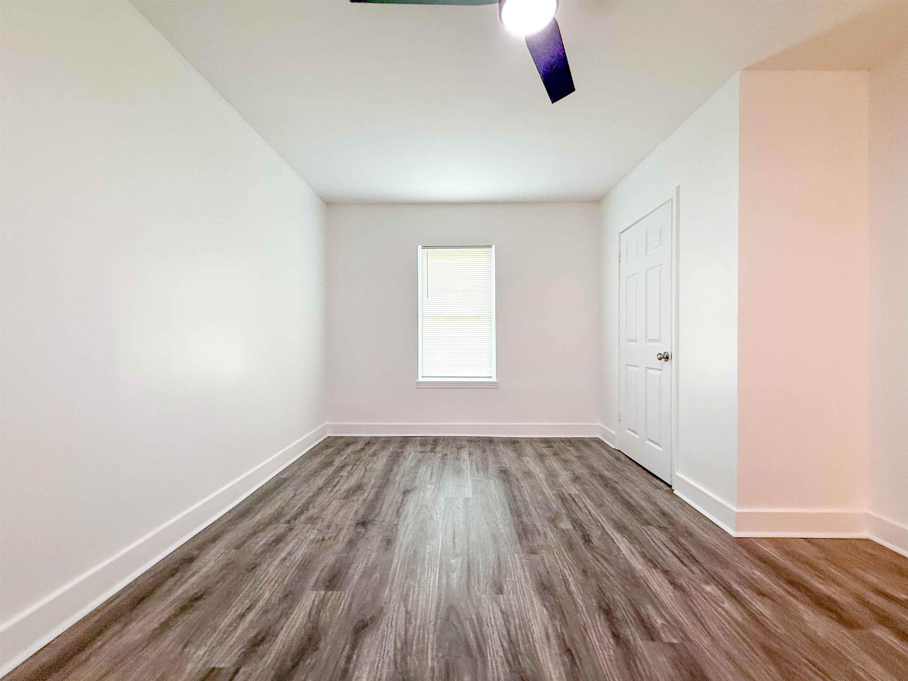 2582 James Road Memphis, TN 38127 - Photo 13 of 36 an empty room with wooden floor and windows