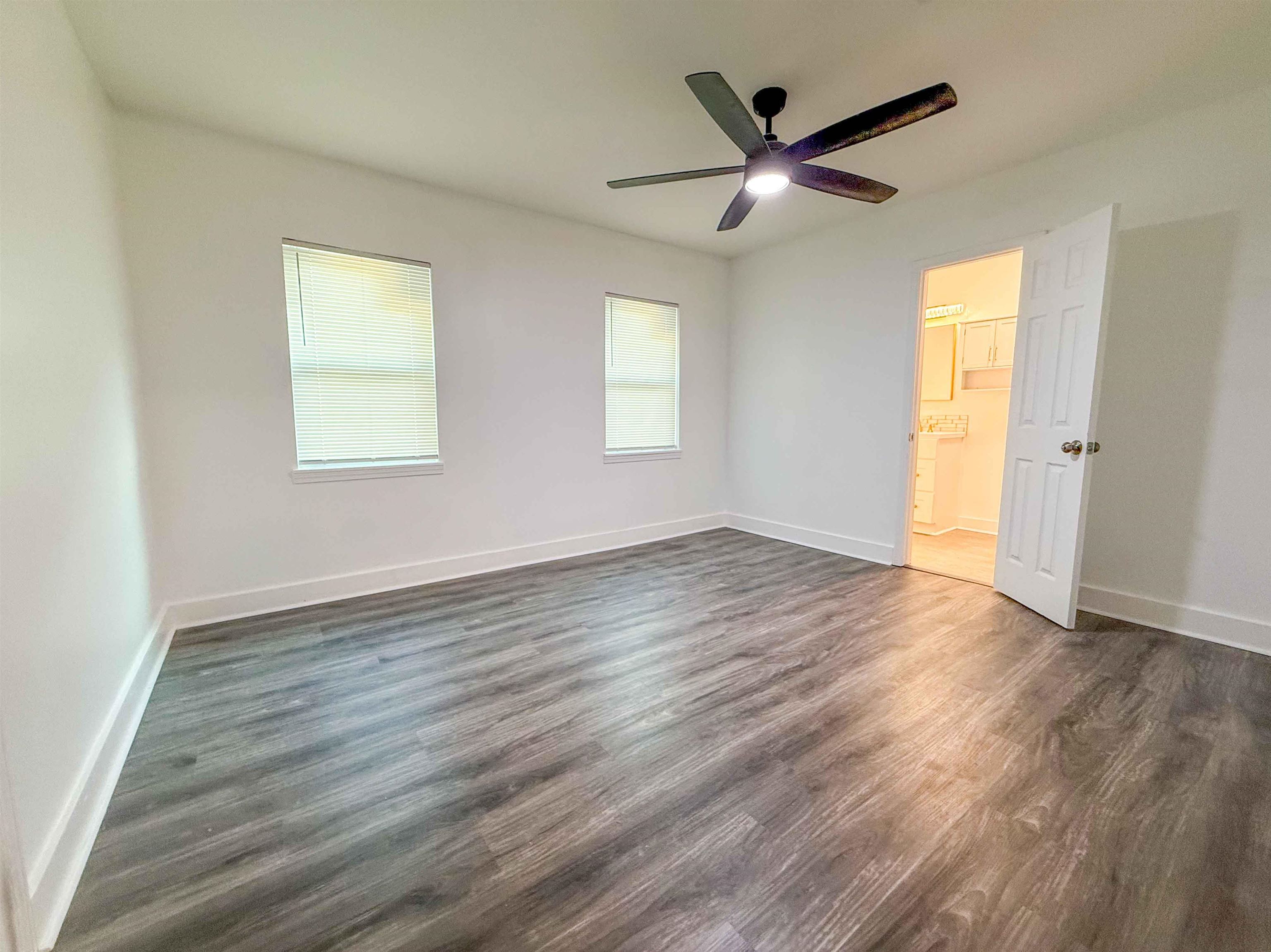 2582 James Road Memphis, TN 38127 - Photo 10 of 36 a view of an empty room with wooden floor and a window