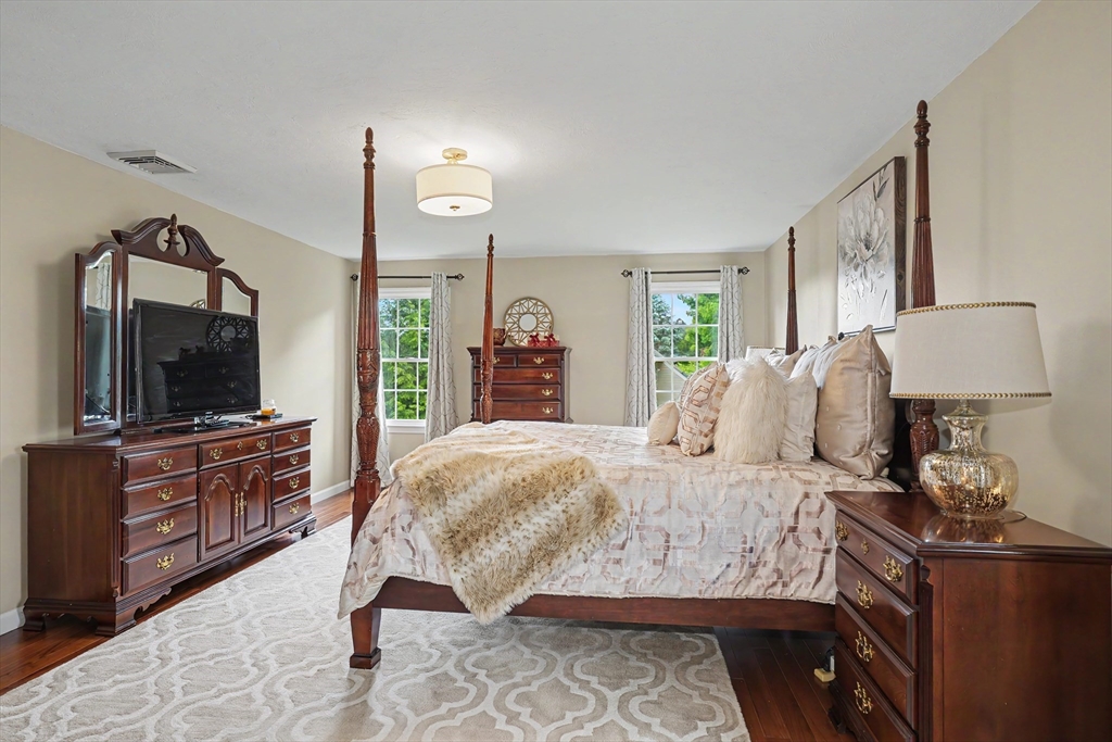 15 Lanthorn Road Northborough, MA 01532 - Photo 21 of 37 a bedroom with a large bed and flat tv